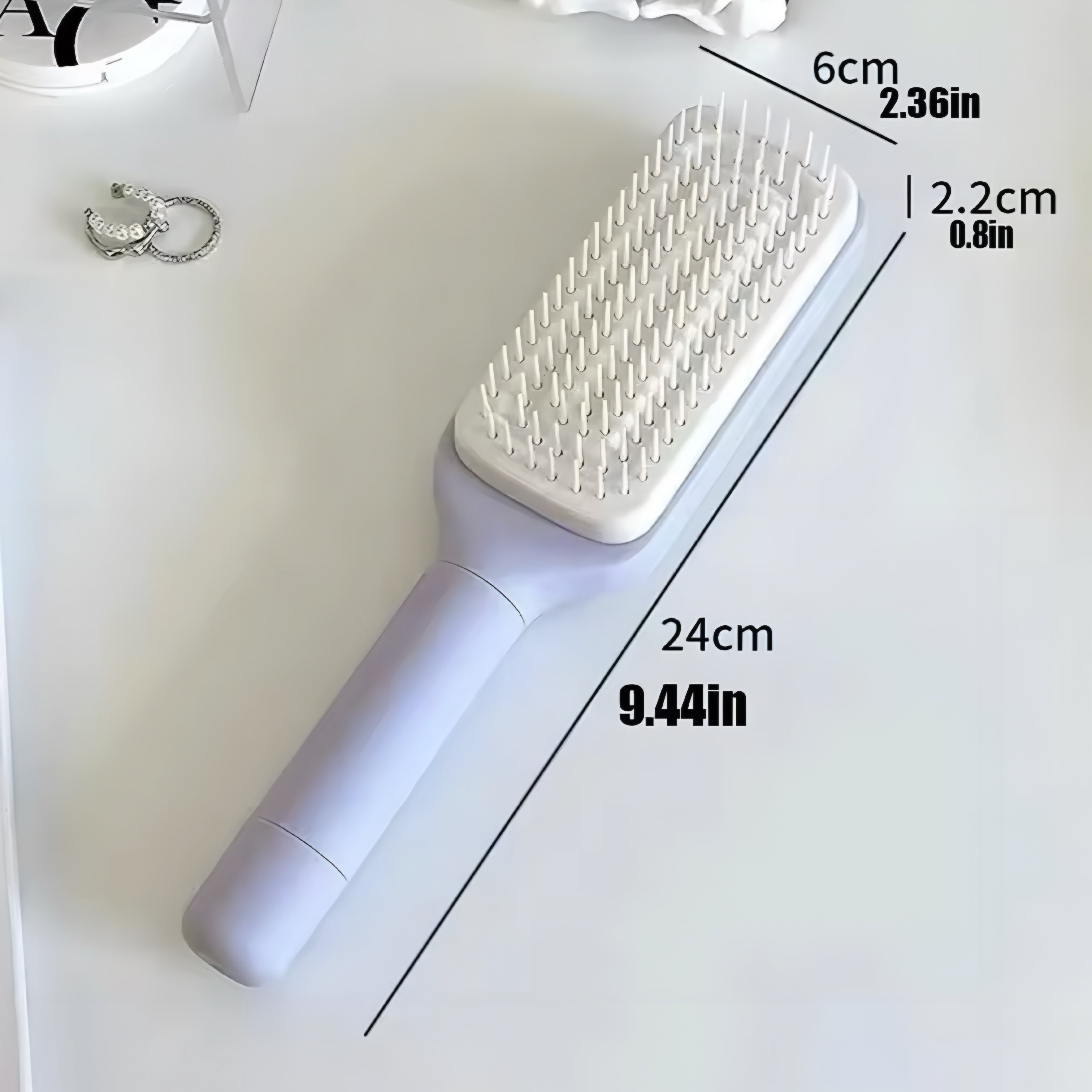 Selbstreinigende Rotierende Haarbürste mit Lift-Kamm