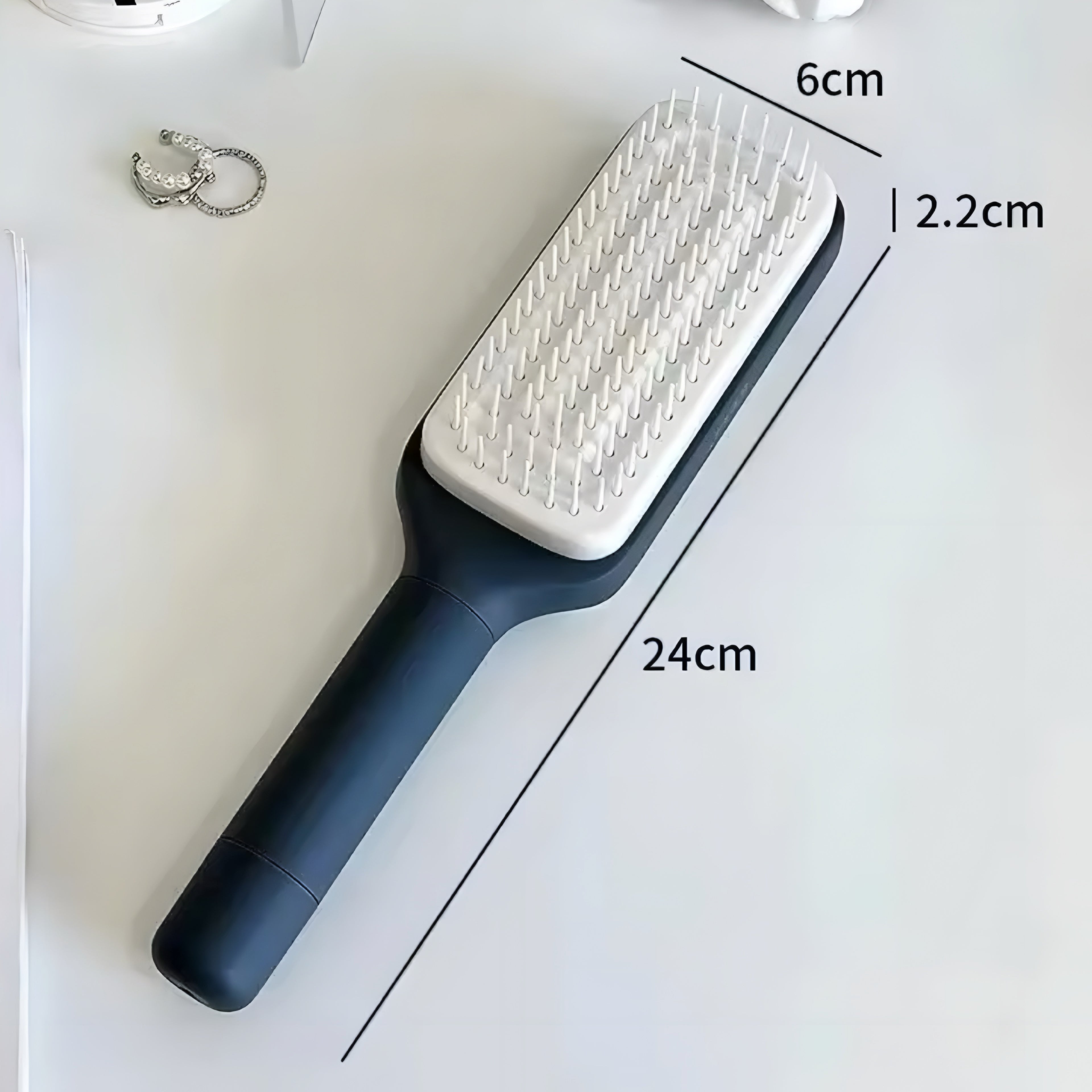 Selbstreinigende Rotierende Haarbürste mit Lift-Kamm